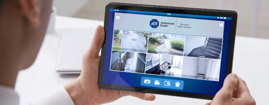 Homeowner viewing live camera feeds on a mobile device